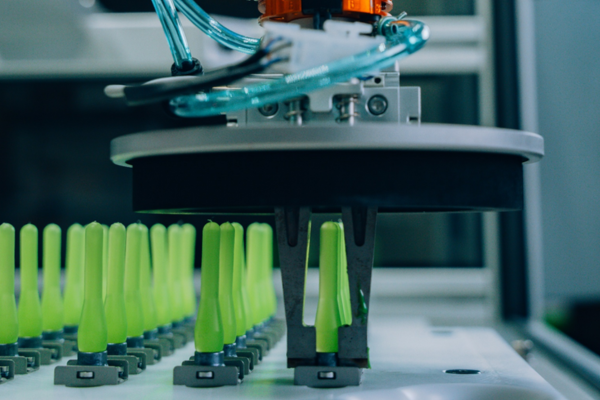 Robotic system positioning fasteners during automated adhesive bonding with Click Bond’s ABT process.